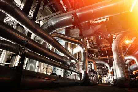 Equipment, cables and piping as found inside of a industrial power plantの写真素材