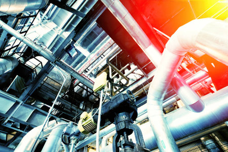 Equipment, cables and piping as found inside of a modern industrial power plant