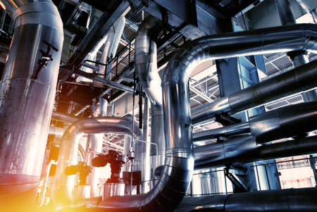 Equipment, cables and piping as found inside of a modern industrial power plant