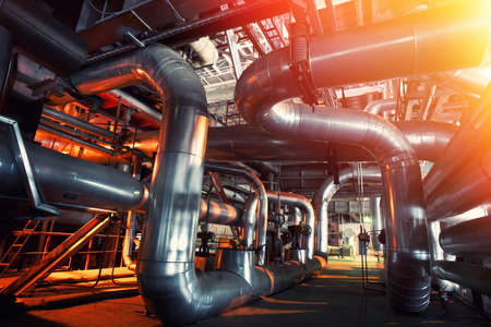 Equipment, cables and piping as found inside of a industrial power plantの写真素材