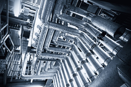 Equipment, cables and piping as found inside of a modern industrial power plant