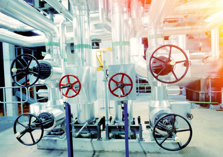 Equipment, cables and piping as found inside of a modern industrial power plant