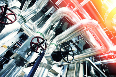 Equipment, cables and piping as found inside of a modern industrial power plantの写真素材