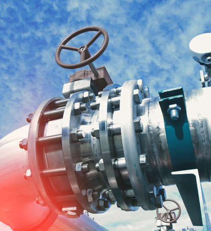 Industrial zone, Steel pipelines and valves against blue skyの写真素材