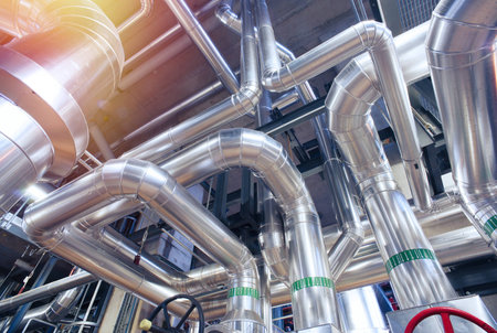 Equipment, cables and piping as found inside of a modern industrial power plant