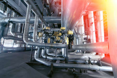 Equipment, cables and piping as found inside of a modern industrial power plantの写真素材