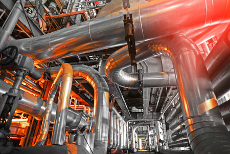 Equipment, cables and piping as found inside of a industrial power plant
