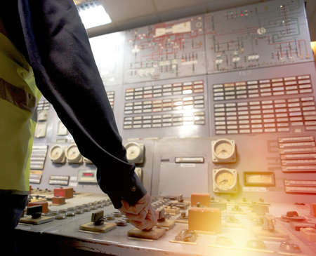 Operator at work place in the system control roomの写真素材