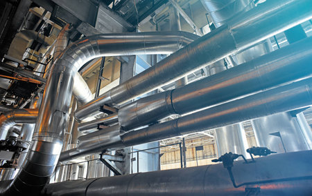 Equipment, cables and piping as found inside of a modern industrial power plant