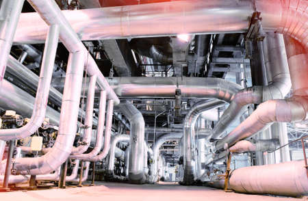 Equipment, cables and piping as found inside of a modern industrial power plant