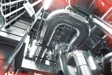 Equipment, cables and piping as found inside of a modern industrial power plant