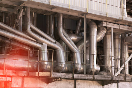 Equipment, cables and piping as found inside of a modern industrial power plant