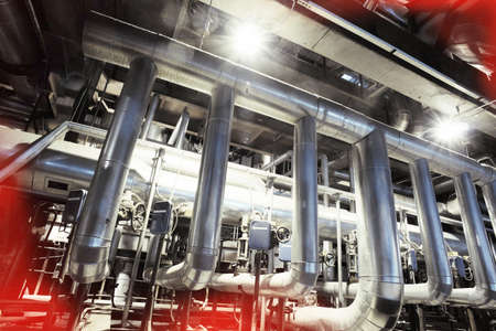 Equipment, cables and piping as found inside of a modern industrial power plant