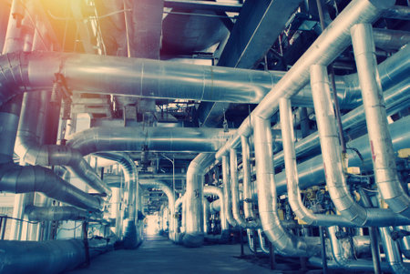 Equipment, cables and piping as found inside of a old industrial power plantの写真素材