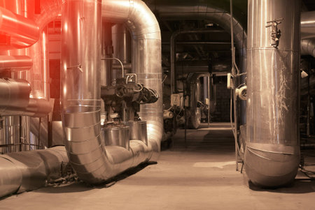 Equipment, cables and piping as found inside of a modern industrial power plant