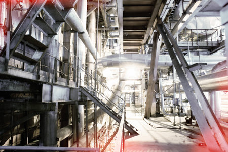 Equipment, cables and piping as found inside of a modern industrial power plant