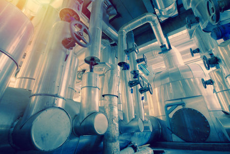 Equipment, cables and piping as found inside of a old industrial power plantの写真素材