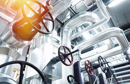 Equipment, cables and piping as found inside of a modern industrial power plant