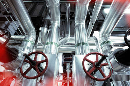 Equipment, cables and piping as found inside of a modern industrial power plant