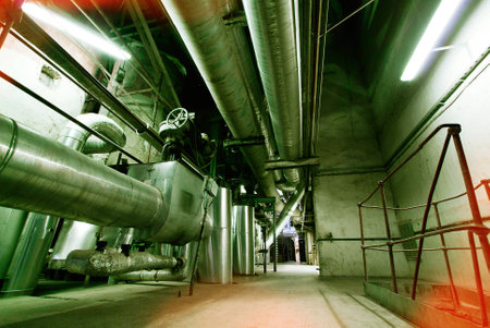 Equipment, cables and piping as found inside of a modern industrial power plant
