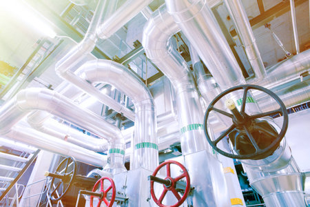 Equipment, cables and piping as found inside of a modern industrial power plant