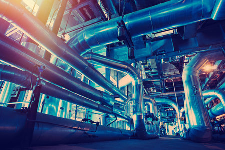 Equipment, cables and piping as found inside of a modern industrial power plant
