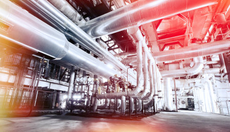 Equipment, cables and piping as found inside of a industrial power plant