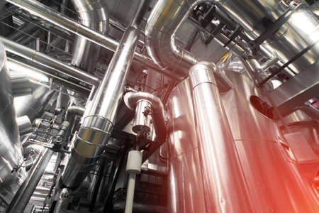 Equipment, cables and piping as found inside of a industrial power plant