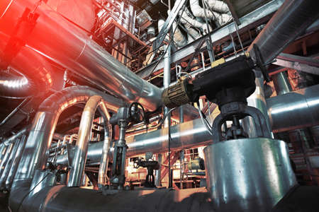 Equipment, cables and piping as found inside of a modern industrial power plantの写真素材