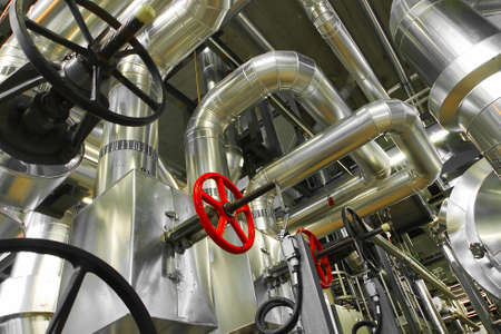 Equipment, cables and piping as found inside of a modern industrial power plant
