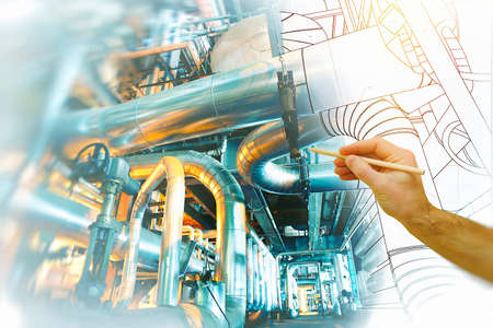 man's hand draws a design of factory combined with photo of modern industrial power plantの写真素材