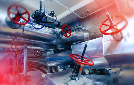 Industrial Factory. Various mechanisms and metal pipes. Toned image. Motion blur effect.
