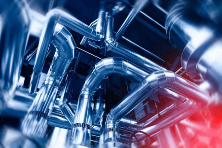 Industrial Factory. Various mechanisms and metal pipes. Toned image. Motion blur effect.の写真素材