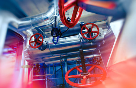 Industrial Factory. Various mechanisms and metal pipes. Toned image. Motion blur effect.の写真素材