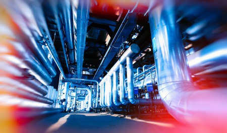 Industrial Factory. Various mechanisms and metal pipes. Toned image. Motion blur effect.の写真素材