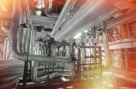 Equipment, cables and piping as found inside of a modern industrial power plant