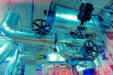 Equipment, cables and piping as found inside of a modern industrial power plant       