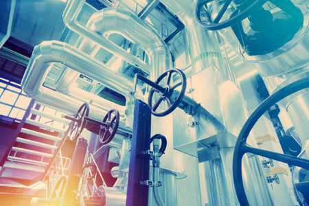 Equipment, cables and piping as found inside of a modern industrial power plant