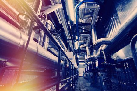Equipment, cables and piping as found inside of a modern industrial power plant