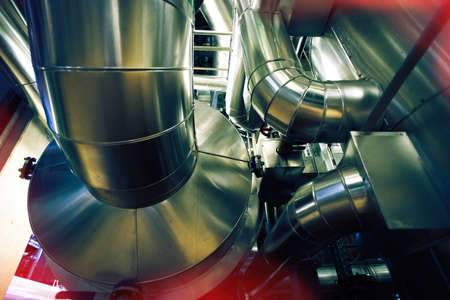 Equipment, cables and piping as found inside of a modern industrial power plantの写真素材