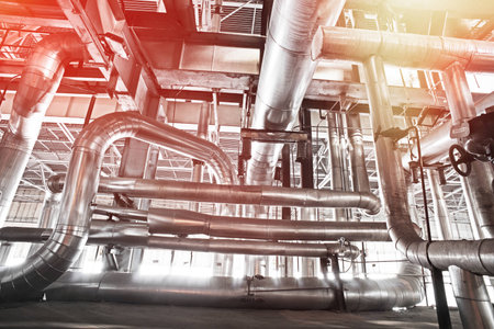 Equipment, cables and piping as found inside of a modern industrial power plant