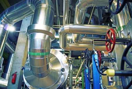 Equipment, cables and piping as found inside of a modern industrial power plant