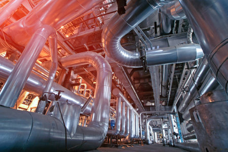 Equipment, cables and piping as found inside of a modern industrial power plantの写真素材