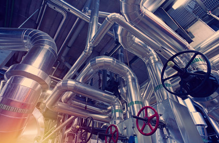 Equipment, cables and piping as found inside of a modern industrial power plantの写真素材