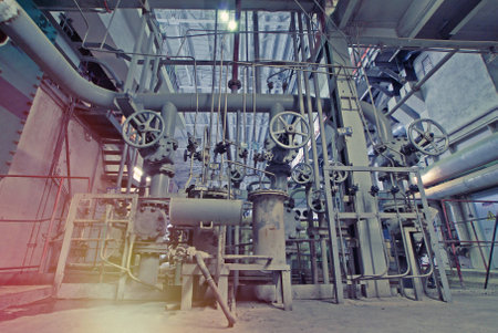Equipment, cables and piping as found inside of a modern industrial power plant