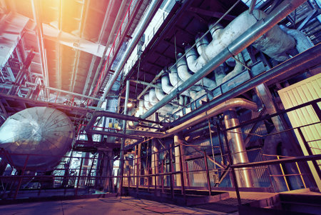 Equipment, cables and piping as found inside of a industrial power plant