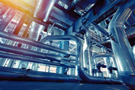 Equipment, cables and piping as found inside of a industrial power plantの写真素材