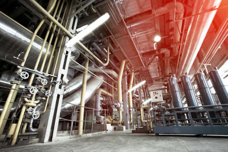 Equipment, cables and piping as found inside of a modern industrial power plant