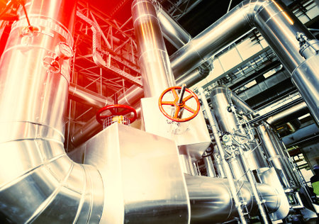 Equipment, cables and piping as found inside of a modern industrial power plant