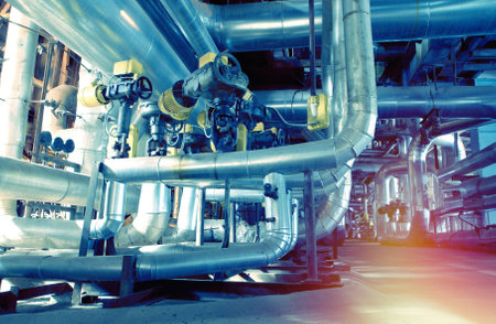 Equipment, cables and piping as found inside of a industrial power plant